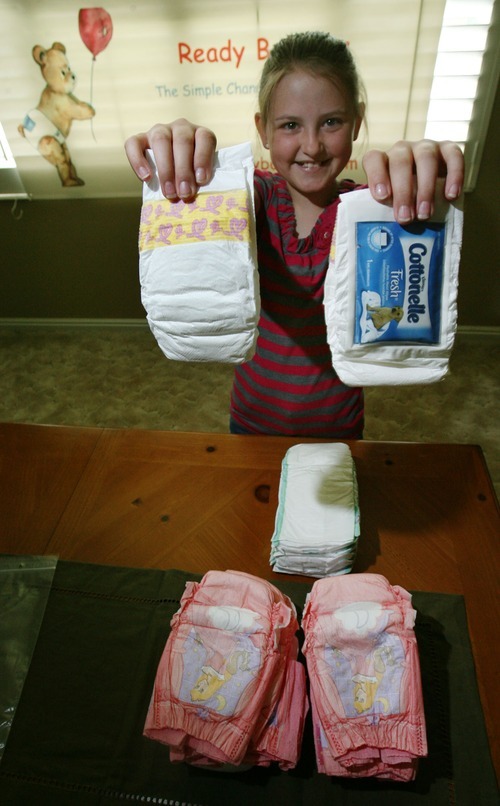 Steve Griffin  |  The Salt Lake Tribune
Nine-year-old Katelynn O'Brien, holds up Ready Bottoms in her Sandy home. Katelynn came up with a unique idea for her school's invention fair: a diaper with a pocket for wipes. She and her mother, Aimee O'Brien, have patented the invention and have started a home-based business called Ready Bottoms.